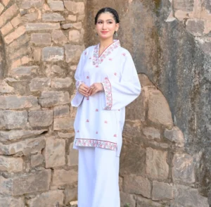 Embroidered white suit by Alifia Couture